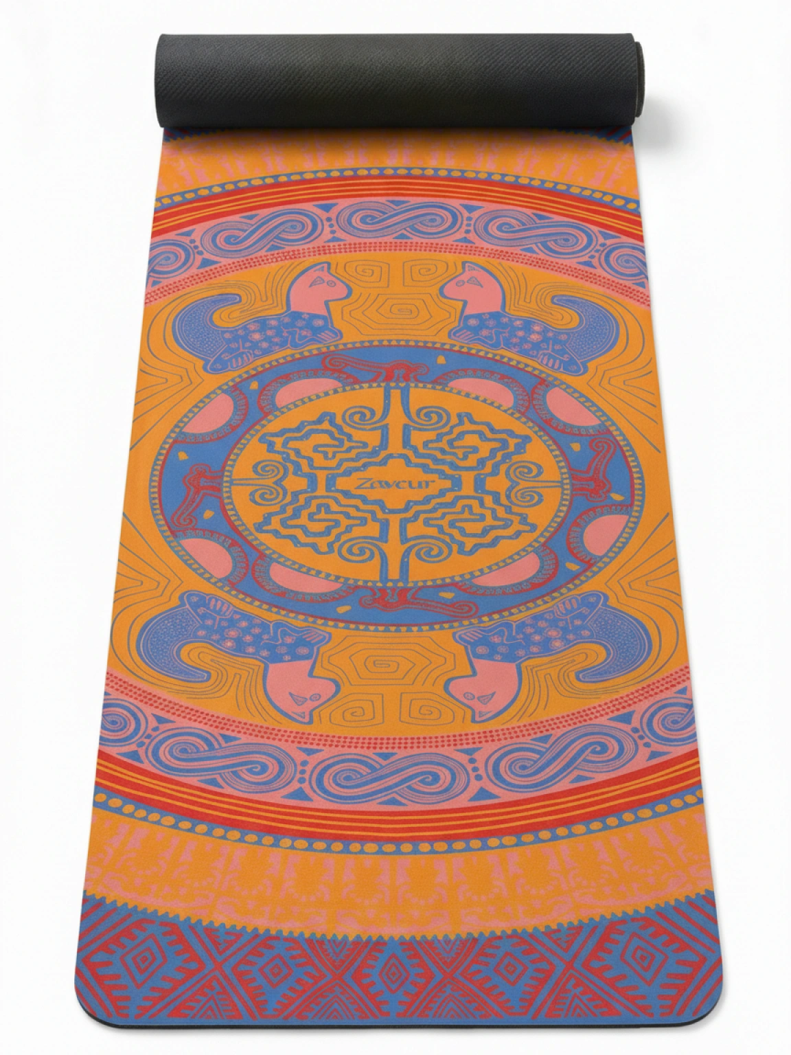 Colombian Dreams yoga mat in orange, coral and blue, partly rolled, a mandala medallion framed by four tigers