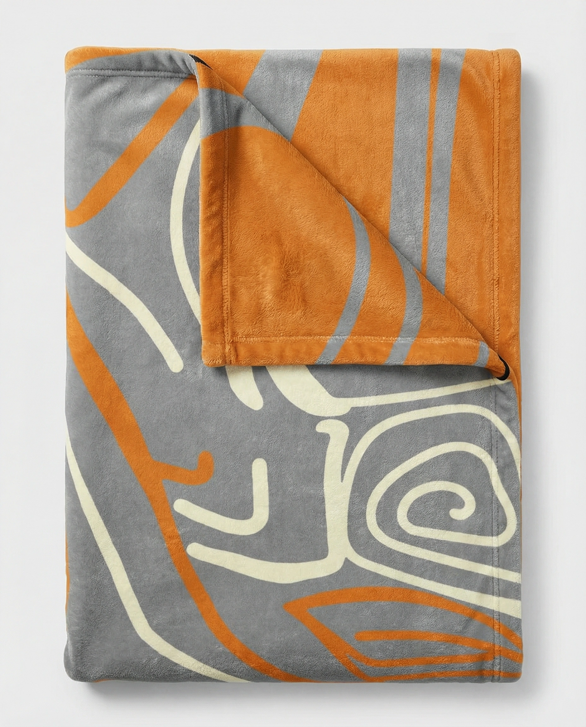 Folded grey Queen of Phoenix blanket turned back to show the orange reverse, cream and orange line art on grey