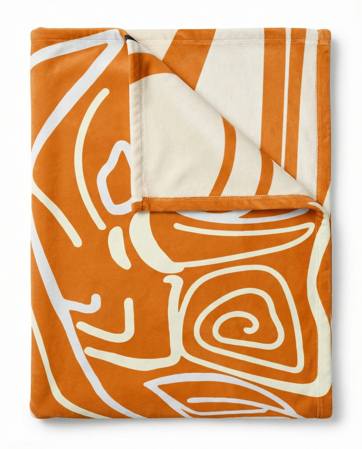 Folded orange Queen of Phoenix blanket turned back to show the cream reverse, bold cream line art on orange
