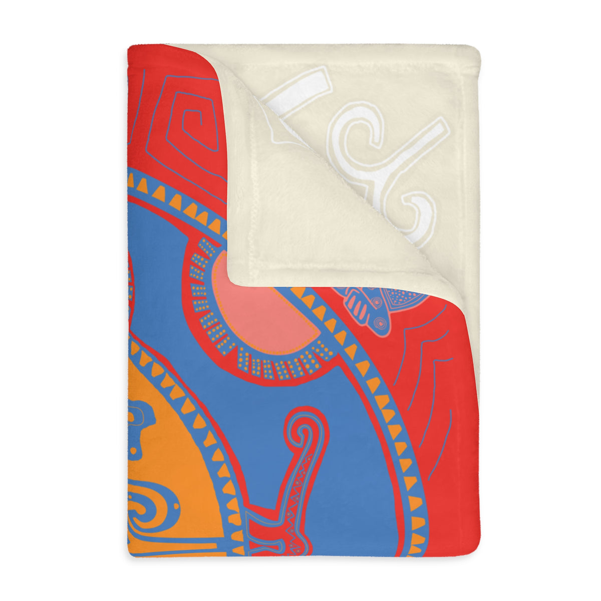 Corner of the Colombian Dreams medallion blanket folded back to show the cream reverse with white motifs