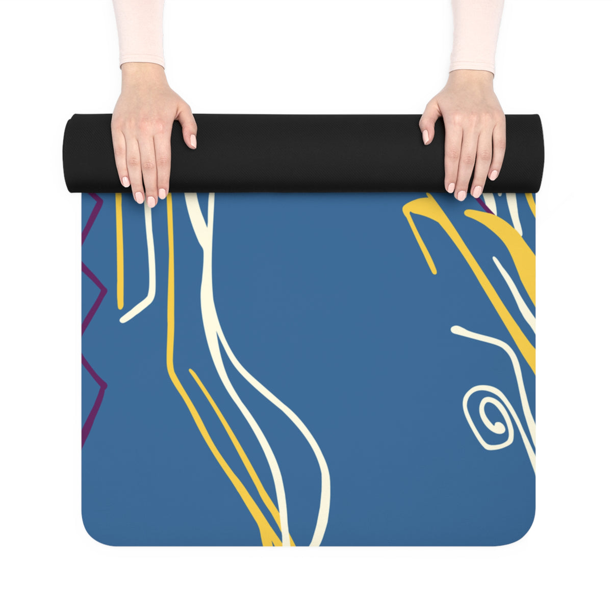 Hands unrolling a Queen of Phoenix blue yoga mat printed with yellow, cream and purple flowing lines