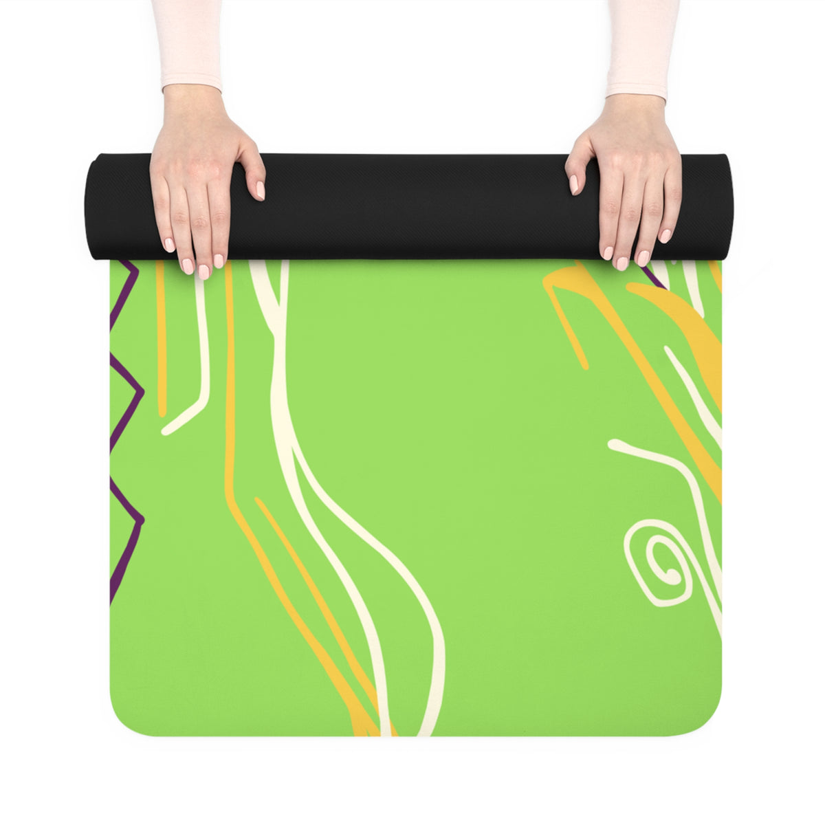 Queen of Phoenix yoga mat in lime green with cream and yellow line art, partly unrolled by hands to show black underside
