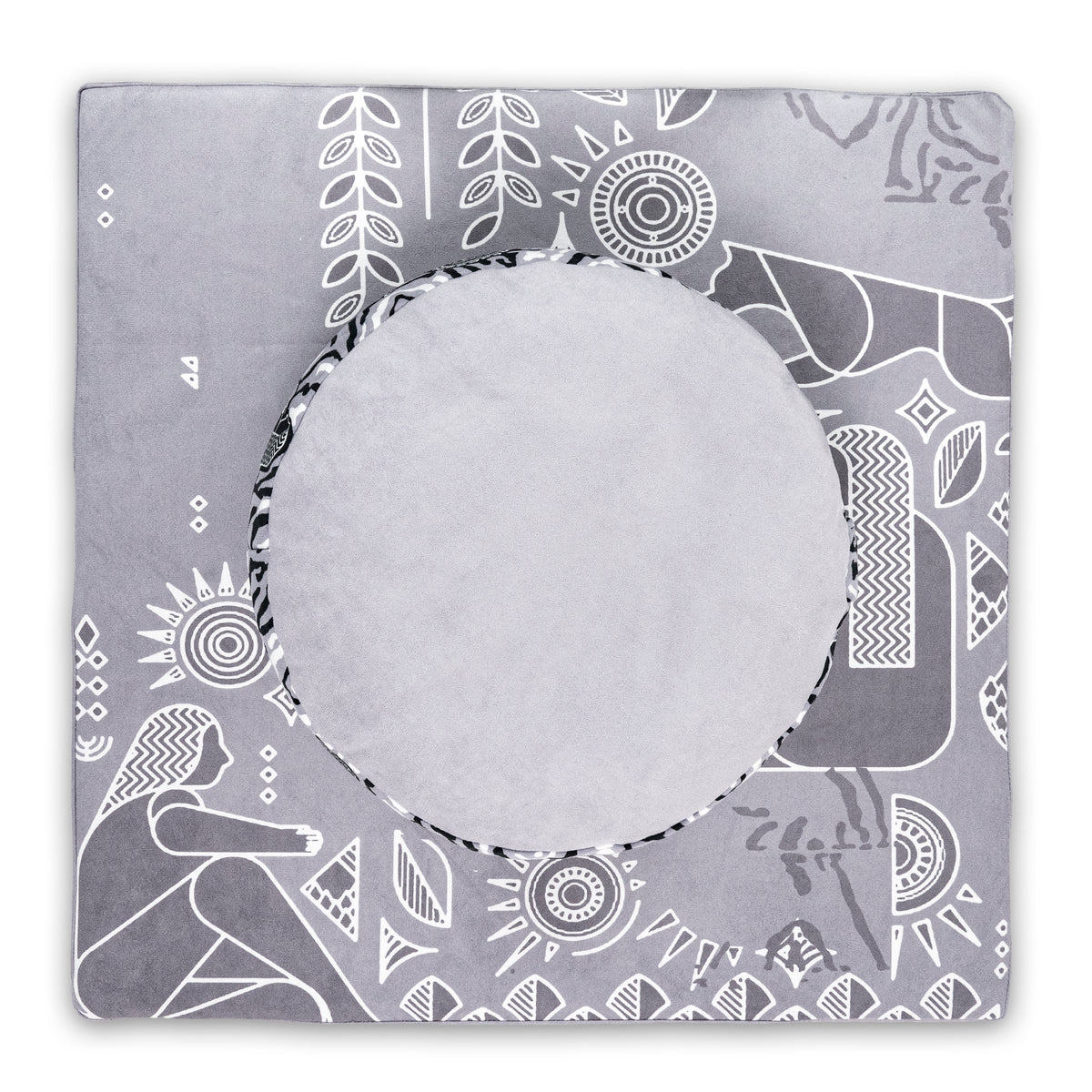 Top view of a round light gray cushion on a square gray mat with white line-art plants, suns and a seated figure, Royal Court