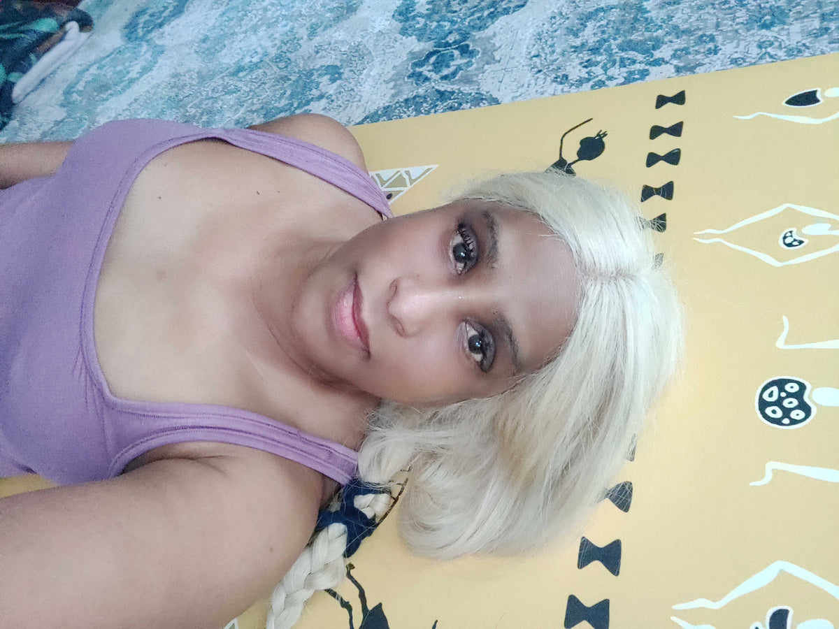 Person taking a selfie with yellow background