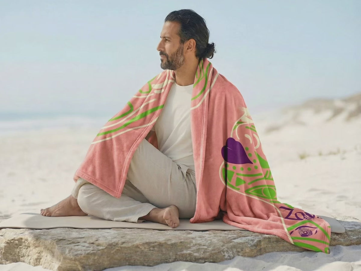 Queen of Phoenix blanket video: coral, grey, aqua and orange blankets worn outdoors and shared on a sofa